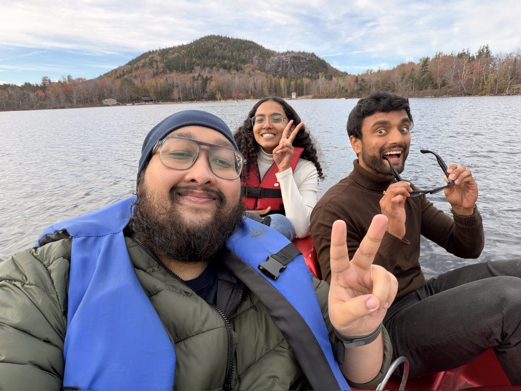 Dave and friends in life jackets on a lake